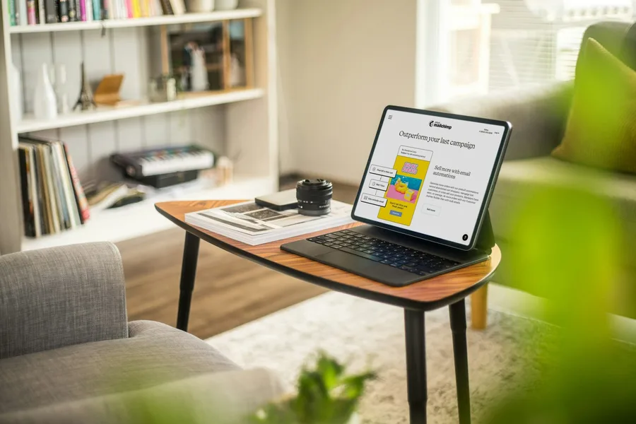A tablet and keyboard in a sunlit home workspace
